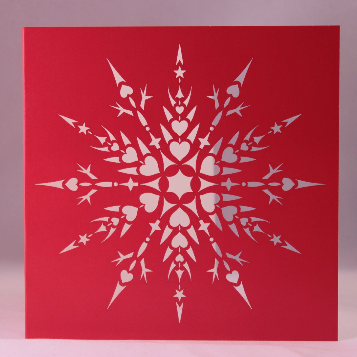 Laser Cut Snowflake Christmas Card. Snowflake With Hearts and Stars