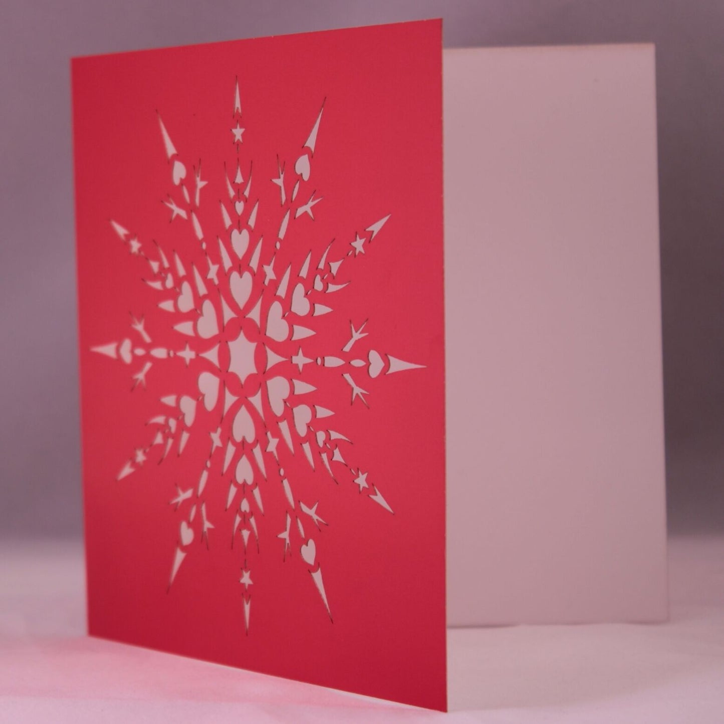Laser Cut Snowflake Christmas Card. Snowflake With Hearts and Stars